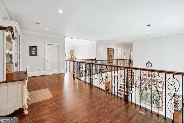 hall with dark hardwood / wood-style floors and ornamental molding