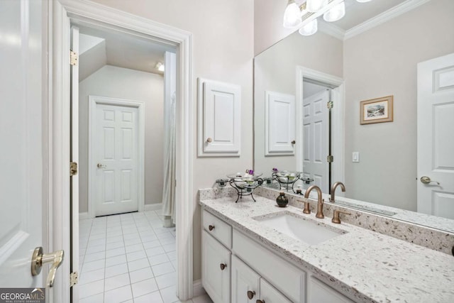 bathroom featuring tile patterned floors, vanity, and crown molding