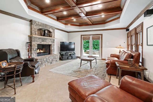 living room featuring wood ceiling, coffered ceiling, a fireplace, french doors, and ornamental molding