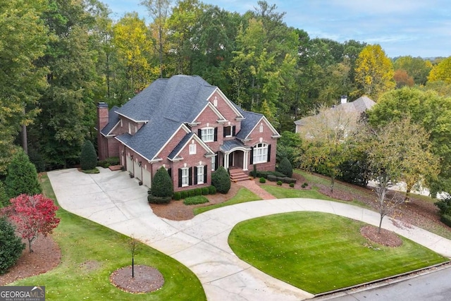 view of front of house with a front lawn and a garage