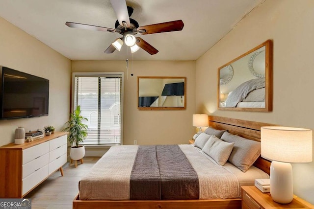 bedroom featuring ceiling fan and light hardwood / wood-style floors