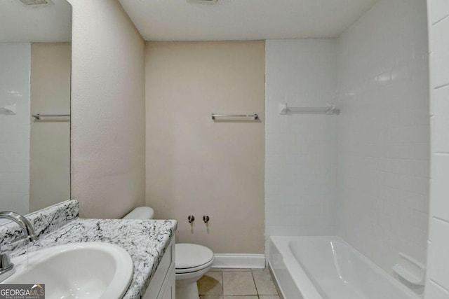 bathroom featuring toilet, vanity, and tile patterned flooring