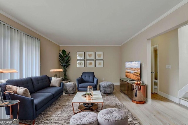 living room featuring ornamental molding and light wood-type flooring