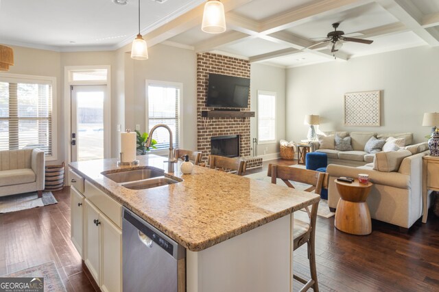 dining space featuring dark wood-type flooring, coffered ceiling, beamed ceiling, and a fireplace