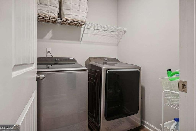 laundry room with independent washer and dryer