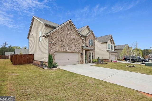 view of front of home with a front yard and a garage