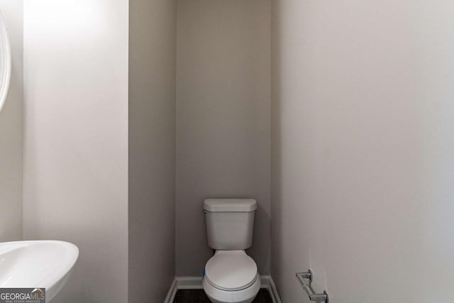 bathroom featuring sink and toilet