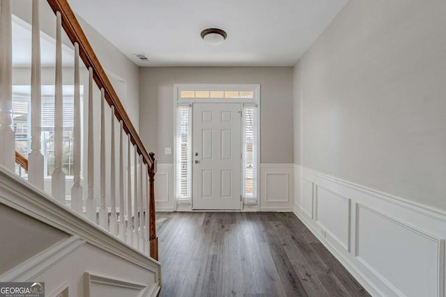 foyer entrance featuring dark hardwood / wood-style floors