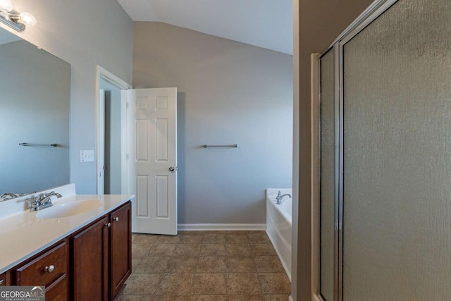 bathroom featuring lofted ceiling, vanity, and shower with separate bathtub