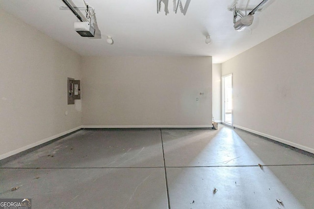 garage featuring a garage door opener and electric panel