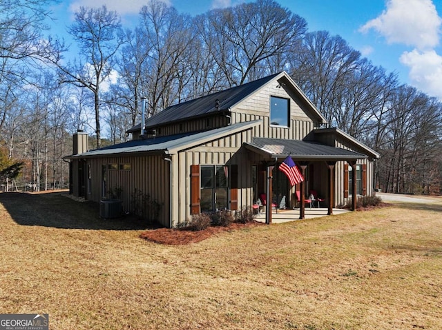 exterior space with a patio area, a yard, and central air condition unit