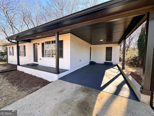 exterior space with a carport