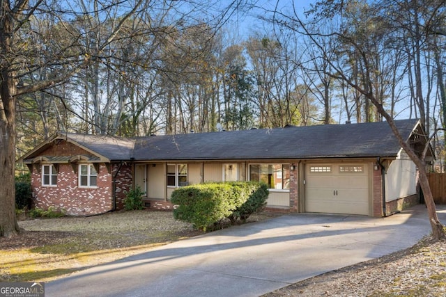 ranch-style house featuring a garage