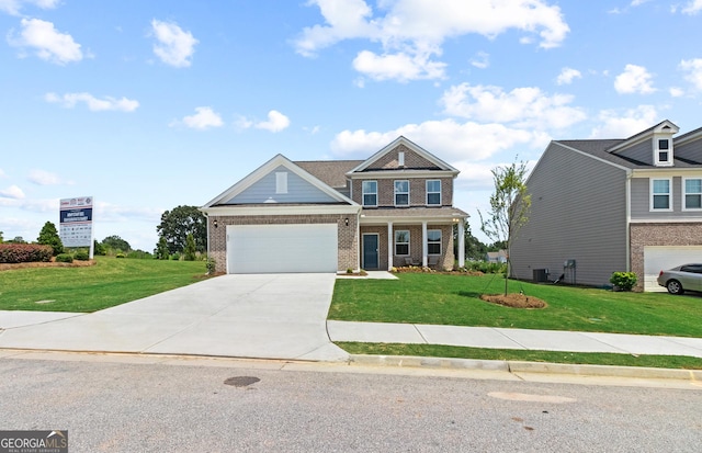 craftsman-style home with central AC, a garage, and a front yard