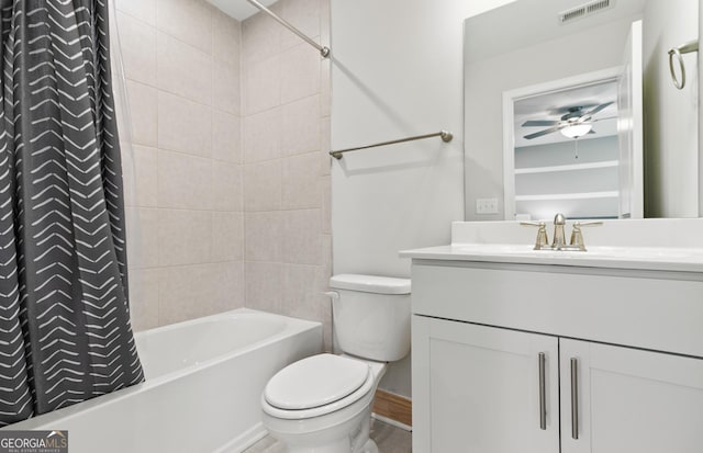 full bathroom featuring toilet, ceiling fan, shower / bath combination with curtain, and vanity