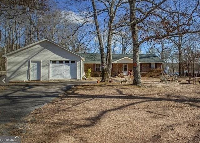 single story home with a garage