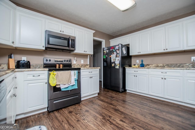 kitchen featuring dark wood-type flooring, appliances with stainless steel finishes, and white cabinets