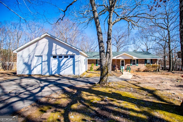 view of side of home featuring a garage