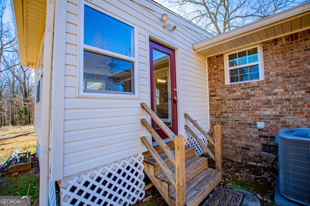 doorway to property with central AC