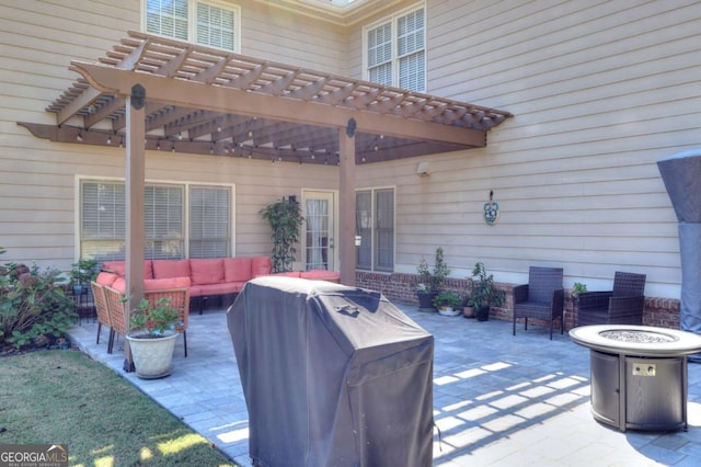 view of patio / terrace featuring an outdoor living space with a fire pit, area for grilling, and a pergola