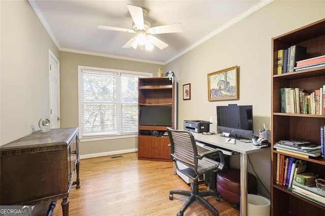 home office with ceiling fan, light hardwood / wood-style floors, and ornamental molding