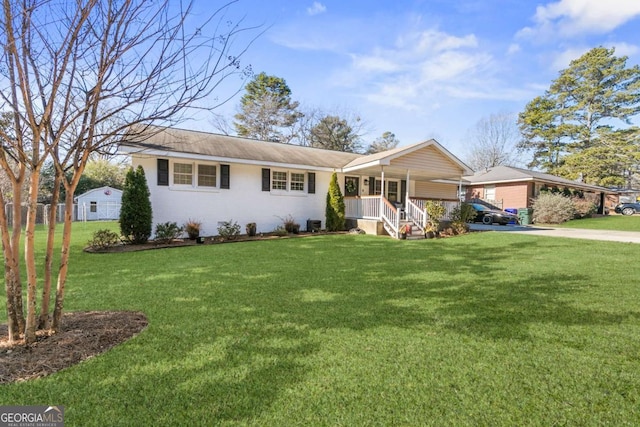 ranch-style house featuring a front yard and a porch