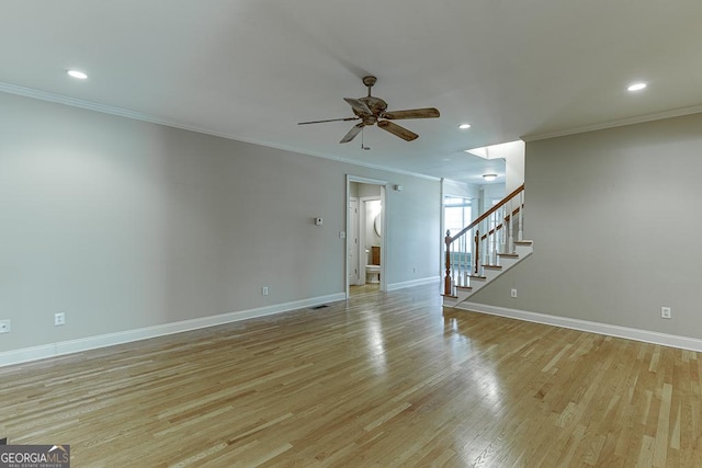 interior space with ceiling fan, crown molding, and light hardwood / wood-style floors