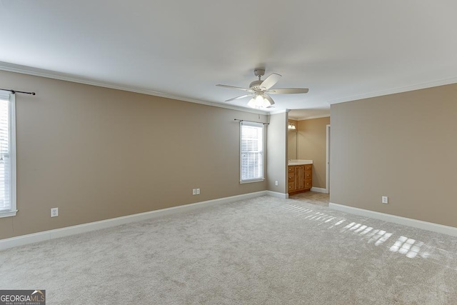 empty room with light carpet, ceiling fan, and ornamental molding