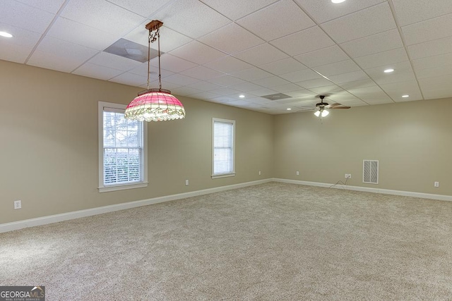 spare room with carpet and ceiling fan