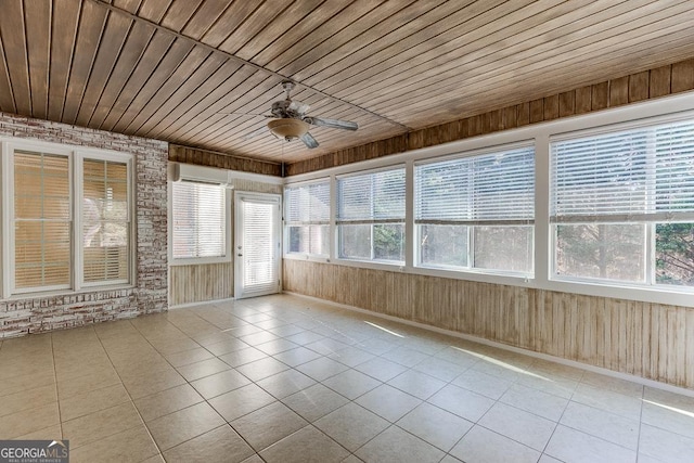 unfurnished sunroom featuring ceiling fan, wooden ceiling, and a wall unit AC