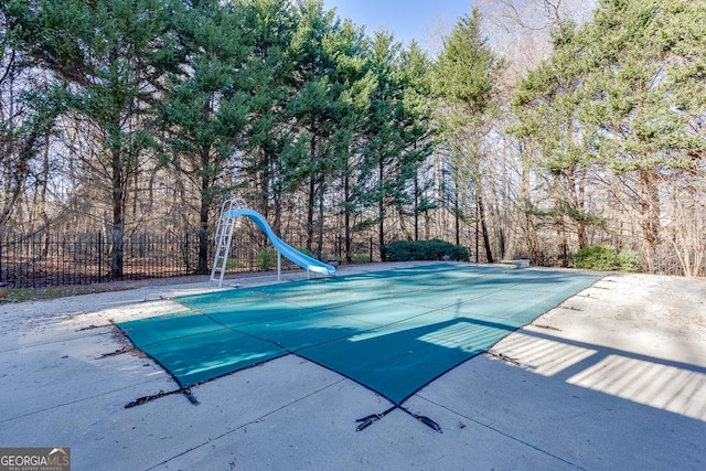 view of swimming pool featuring a water slide