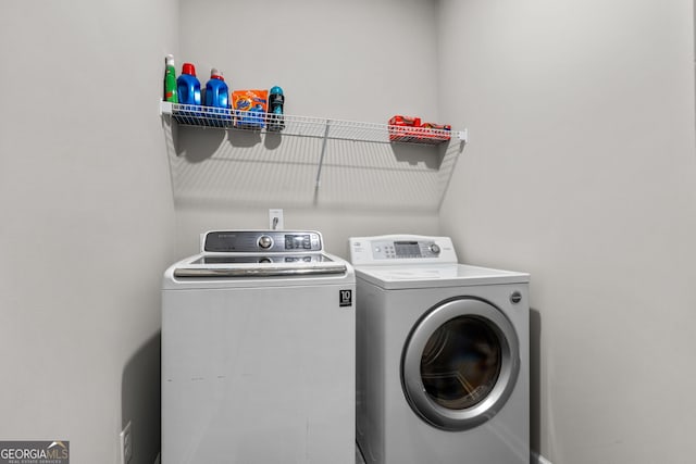 laundry room featuring washing machine and dryer