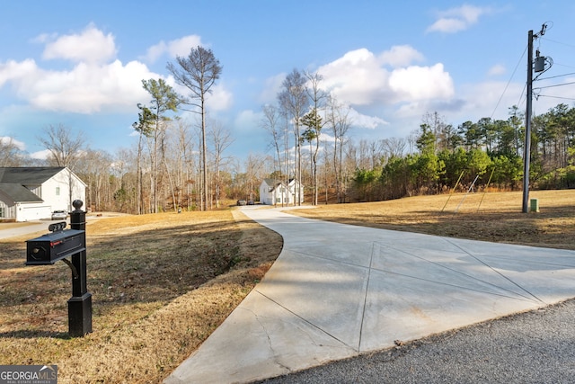 view of property's community with a yard