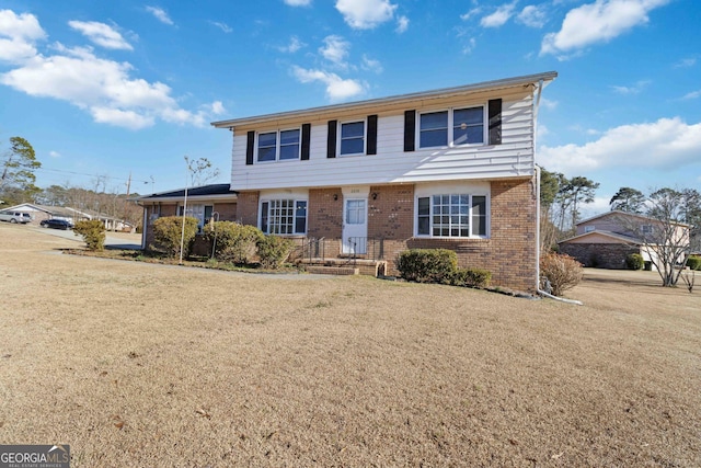 front facade with a front yard