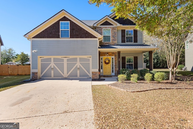 craftsman house with a garage and a porch