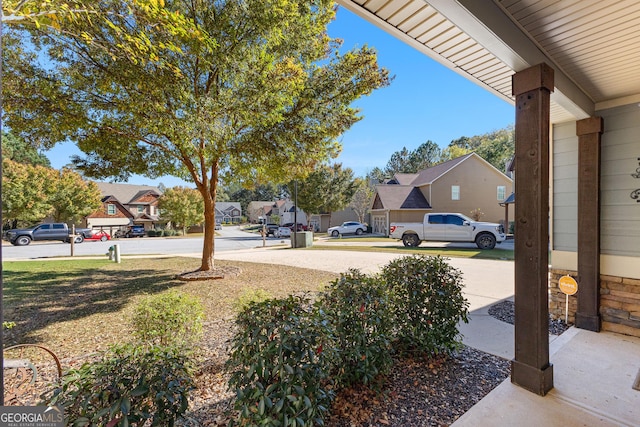 view of yard with covered porch