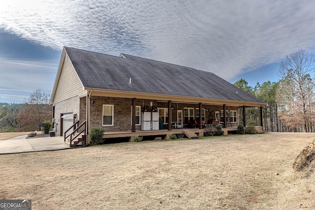 view of front of house featuring covered porch and a garage