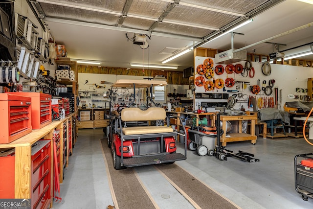 garage featuring a workshop area and a garage door opener