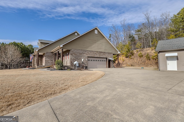 view of side of home with a garage and a yard