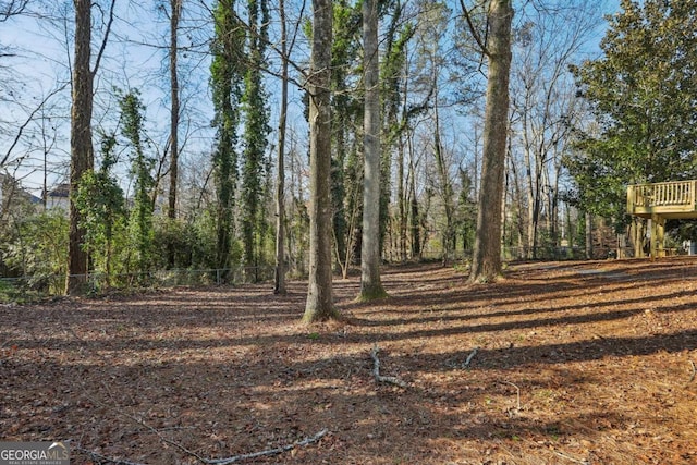 view of yard with a wooden deck