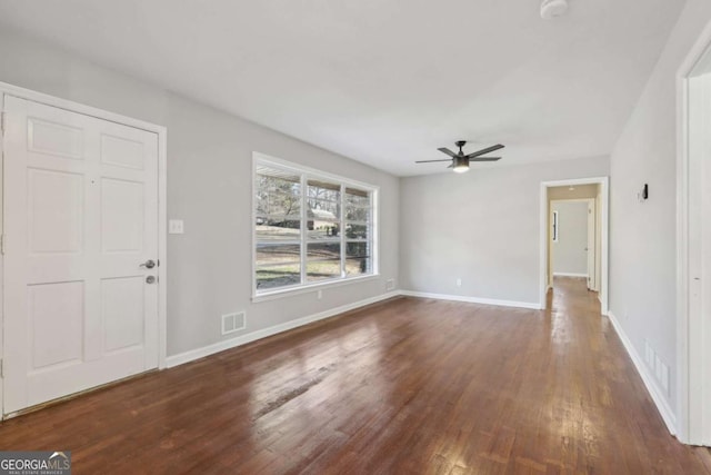 entrance foyer featuring ceiling fan and dark hardwood / wood-style flooring