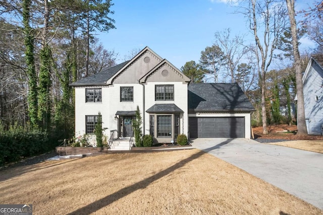 view of front facade with a front yard and a garage