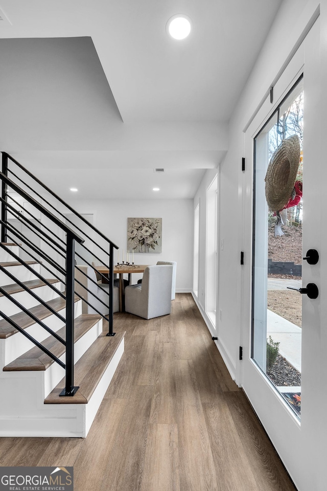 foyer entrance featuring hardwood / wood-style floors