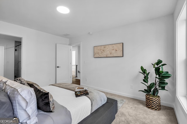 bedroom featuring light carpet