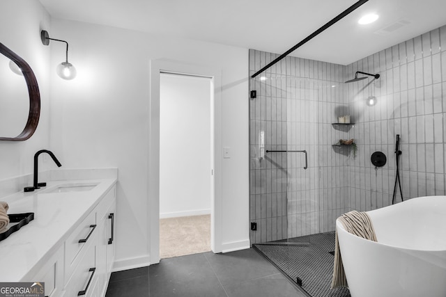 bathroom featuring vanity, tile patterned flooring, and shower with separate bathtub