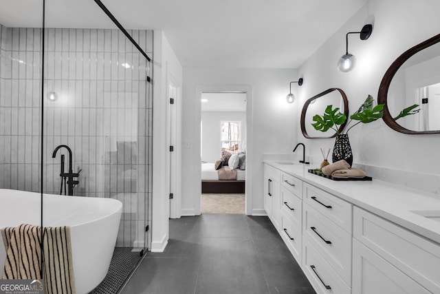 bathroom with vanity and a washtub