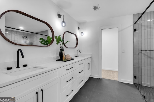 bathroom with vanity, an enclosed shower, and tile patterned flooring