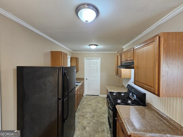 kitchen with black appliances and crown molding