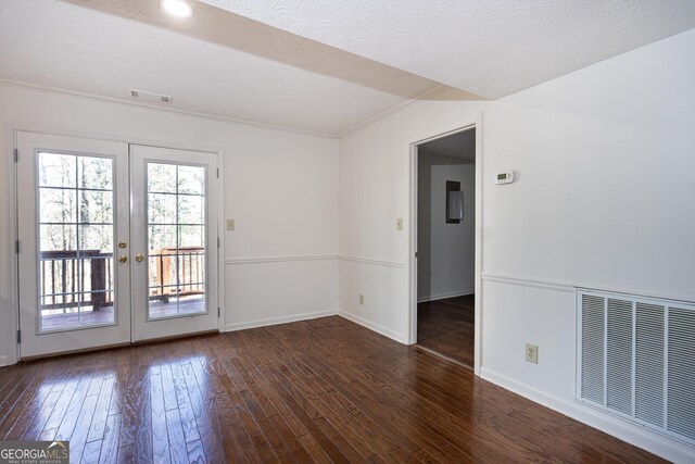 unfurnished living room featuring a textured ceiling, dark wood-type flooring, french doors, ceiling fan, and crown molding