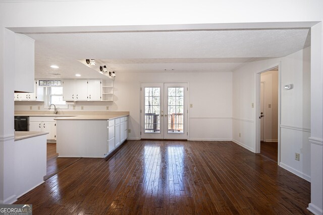 kitchen with sink, white cabinets, and stainless steel range with gas stovetop